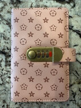 Pink Patterned money saving binder with Combination Lock.